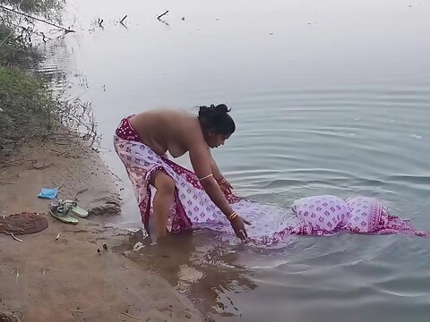 Indian village wifey wash up in the briny deep in outdoor realm, village wifey wash up outside, indian housewife cherish in the sea, utter open wash up in the sea, indian wifey open wash up in the sea, Scanty bathtub outdoor, milk cans showcase, perfect n